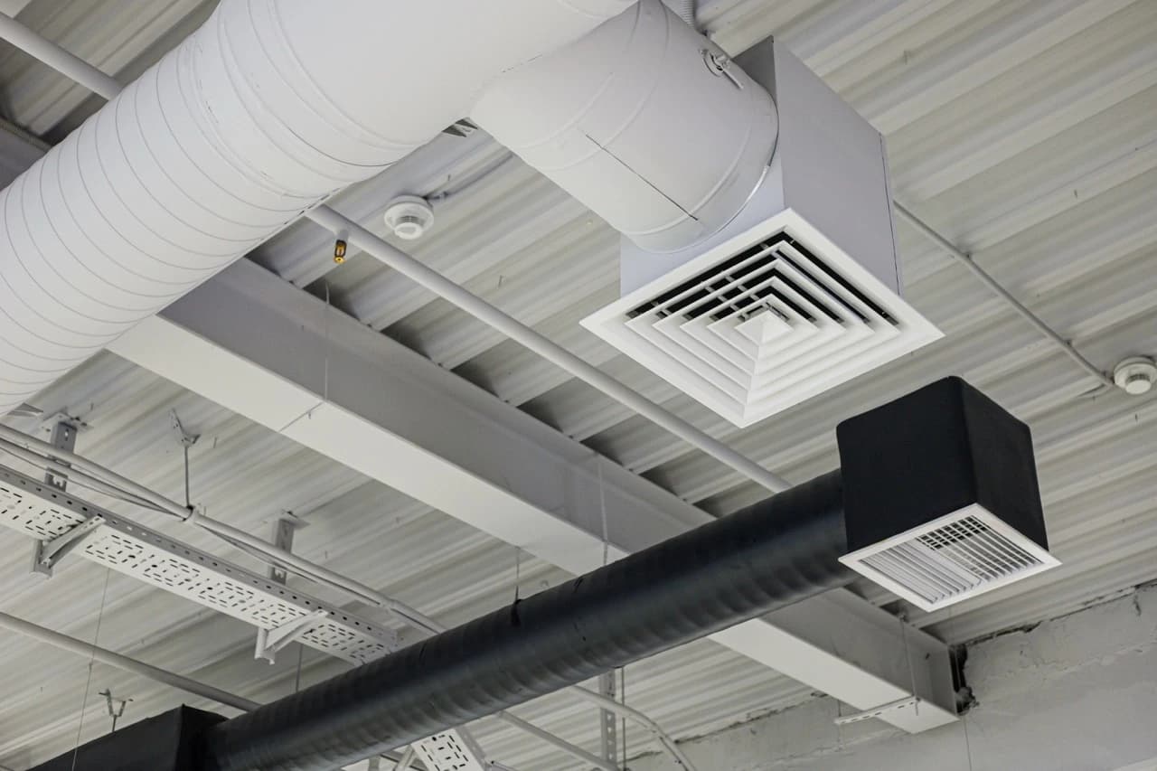 Ducted air conditioning outlets integrated into a ceiling